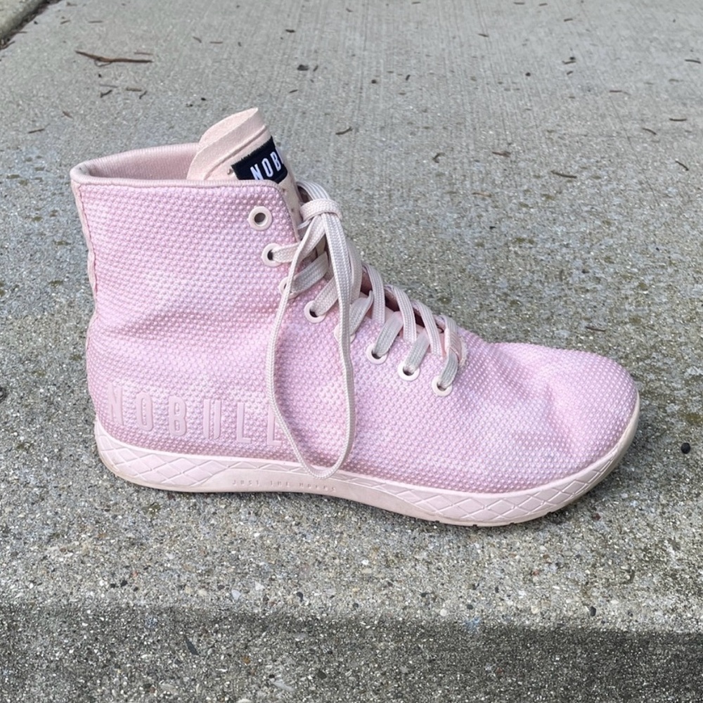 NOBULL Women's Light Pink camouflage High-Top trainers.